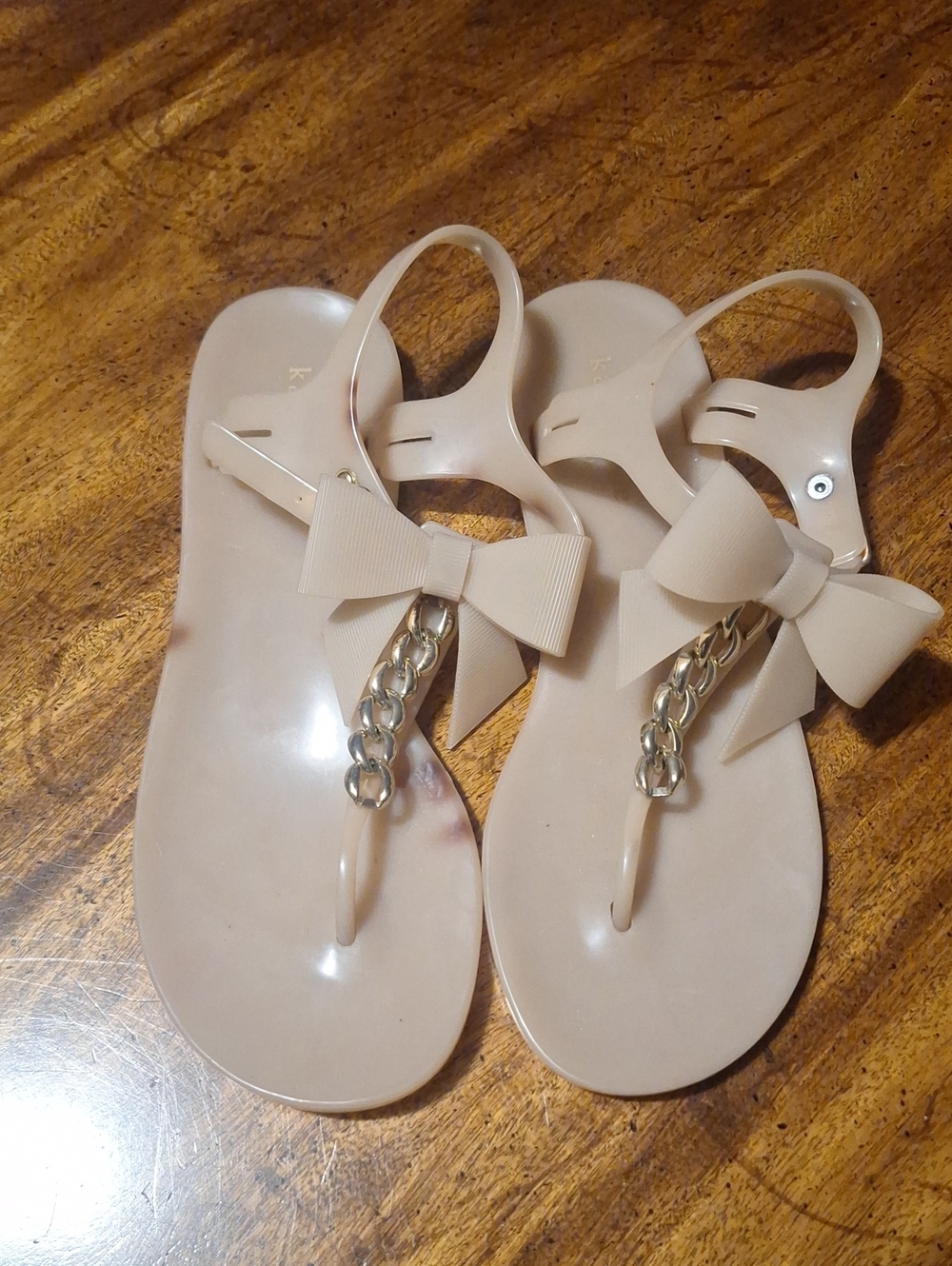 Kate Spade Beige Bow Jelly Sandals with Gold Chain Accent